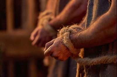 The wrists of Alma the Younger and Amulek are bound. Image via churchofjesuschrist.org.