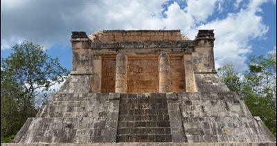 Temple of the Bearded Man (featuring two entrance pillars) at Chichen Itza. Image via flickr.com.