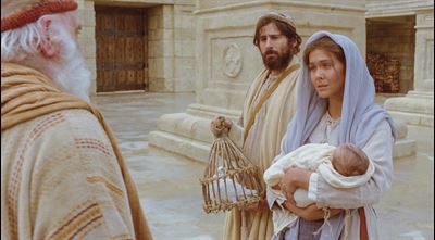 Mary, Joseph, and baby Jesus at the temple.
