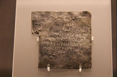 One of the 130 Bath curse tablets. The inscription in British Latin translates as: “May he who carried off Vilbia from me become liquid as the water. May she who so obscenely devoured her become dumb.” Image and description via wikipedia.com.