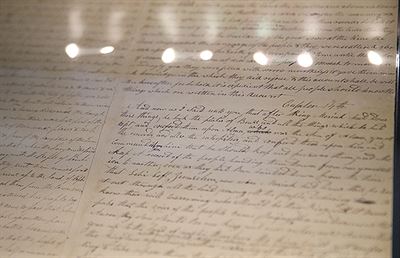 Pages of the printer’s manuscript on display at the Church History Library in Salt Lake City. Photo by Spenser Heaps. Image via churchofjesuschrist.org.